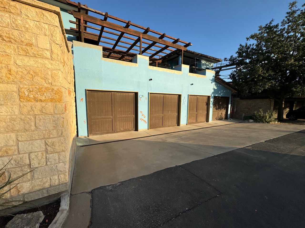 Garage exterior coated with blue waterproofing system